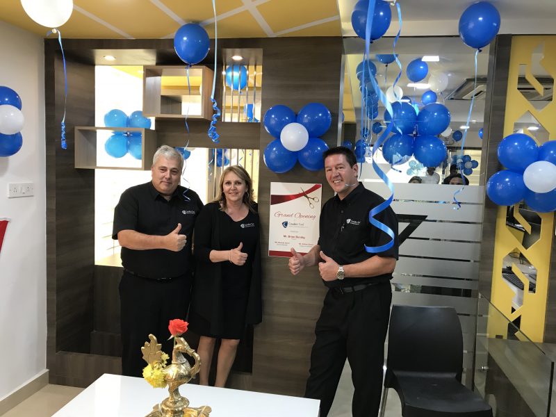 left to right - Adrian Dixon, Brenda Quint, and Brian Bendig. They are surrounded by blue baloons to celebrate the opening of CTI
