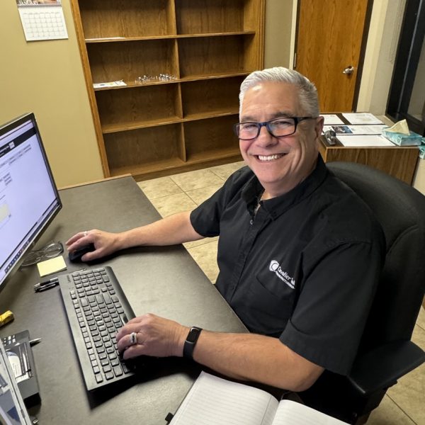 New Cavalier Tool GM Doug Brockman pictured sitting at his desk with a spreadsheet open.