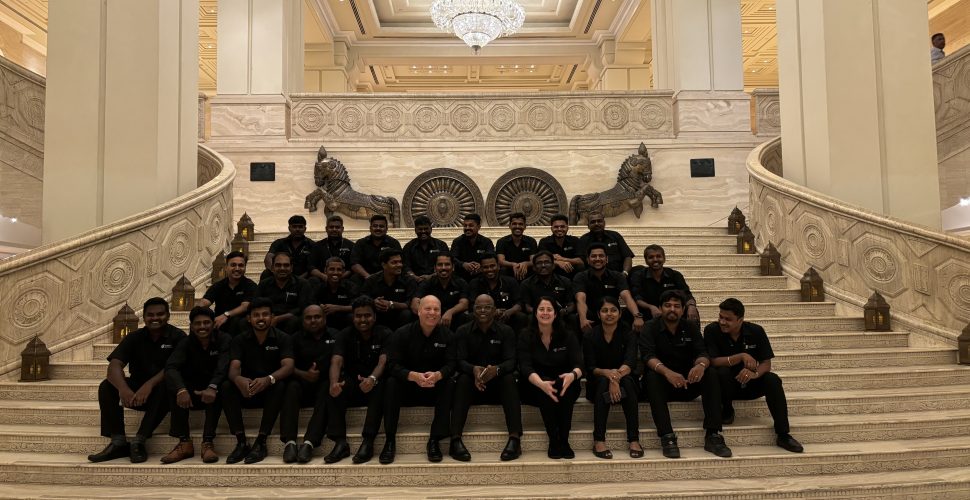 Cavalier Tool India Team posing on the steps of a banquet hall.